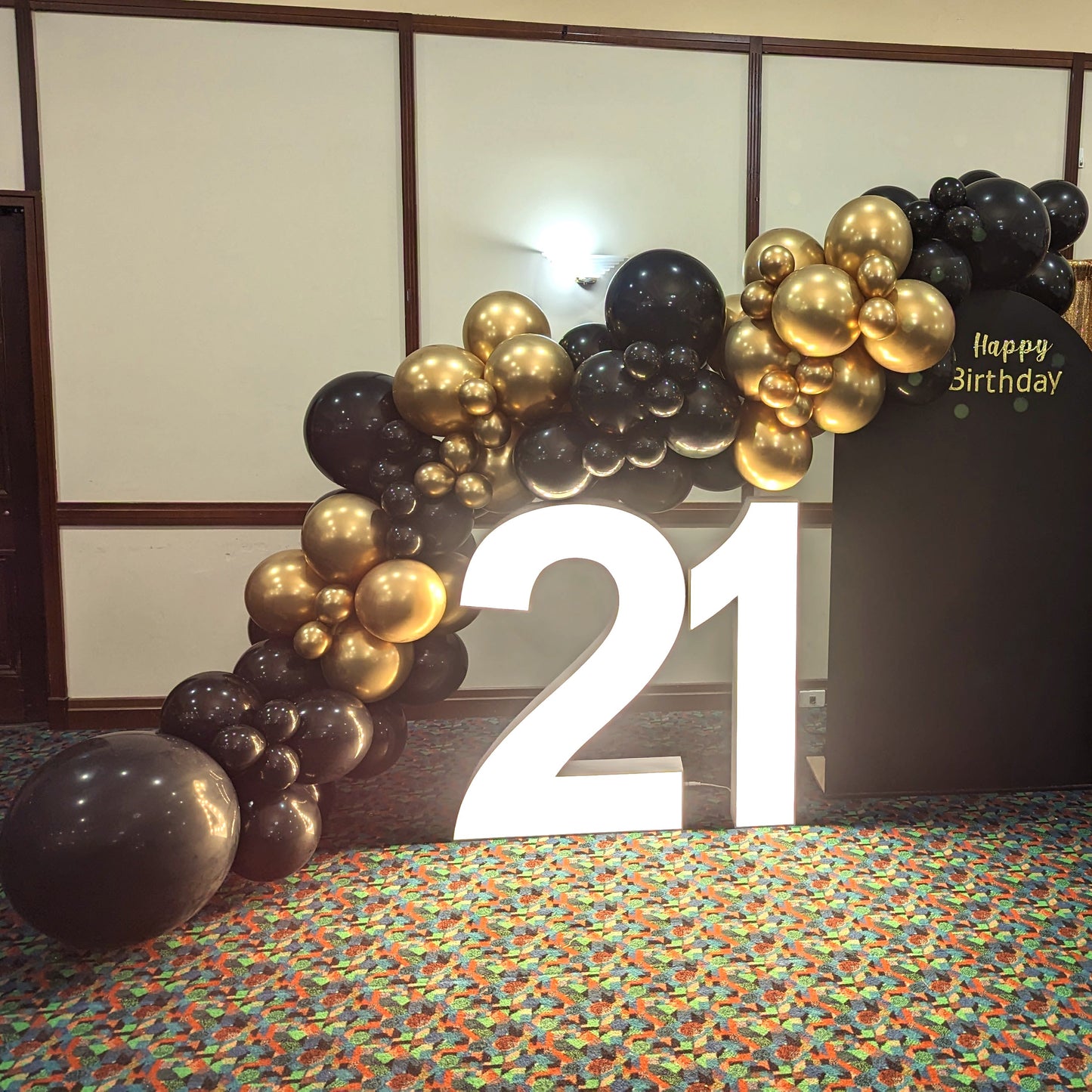 Illuminated '21' with black and gold balloon arch, and 'Happy Birthday' sign. Prop hire, Prop hiring, Prop hire, event stylists Brisbane, brisbane event styling, brisbane event styling, event stylist Brisbane, Brisbane Wedding, Gold Coast Wedding, Floral Styling, Lush & Lavish Events, Brisbane Tablescape, Gold Coast Tablescapes, Brisbane Candle Hire