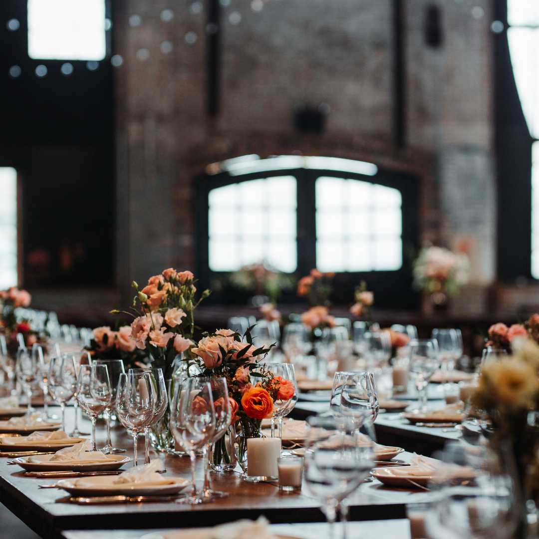 Rustic venue dining table with elegant glassware, floral centerpieces, and candles, lit by natural light. Prop hire, Prop hiring, Prop hire, event stylists Brisbane, brisbane event styling, brisbane event styling, event stylist Brisbane, Brisbane Wedding, Gold Coast Wedding, Floral Styling, Lush & Lavish Events, Brisbane Tablescape, Gold Coast Tablescapes, Brisbane Candle Hire