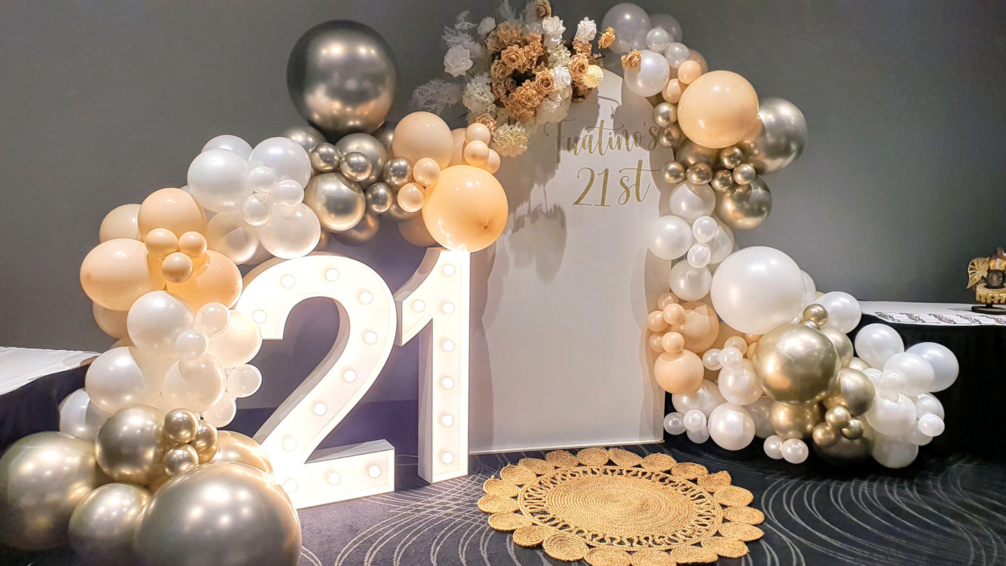 Illuminated '21' sign with white, gold, and silver balloon arrangement, white backdrop, and floral decor. Prop hire, Prop hiring, Prop hire, event stylists Brisbane, brisbane event styling, brisbane event styling, event stylist Brisbane, Brisbane Wedding, Gold Coast Wedding, Floral Styling, Lush & Lavish Events, Brisbane Tablescape, Gold Coast Tablescapes, Brisbane Candle Hire