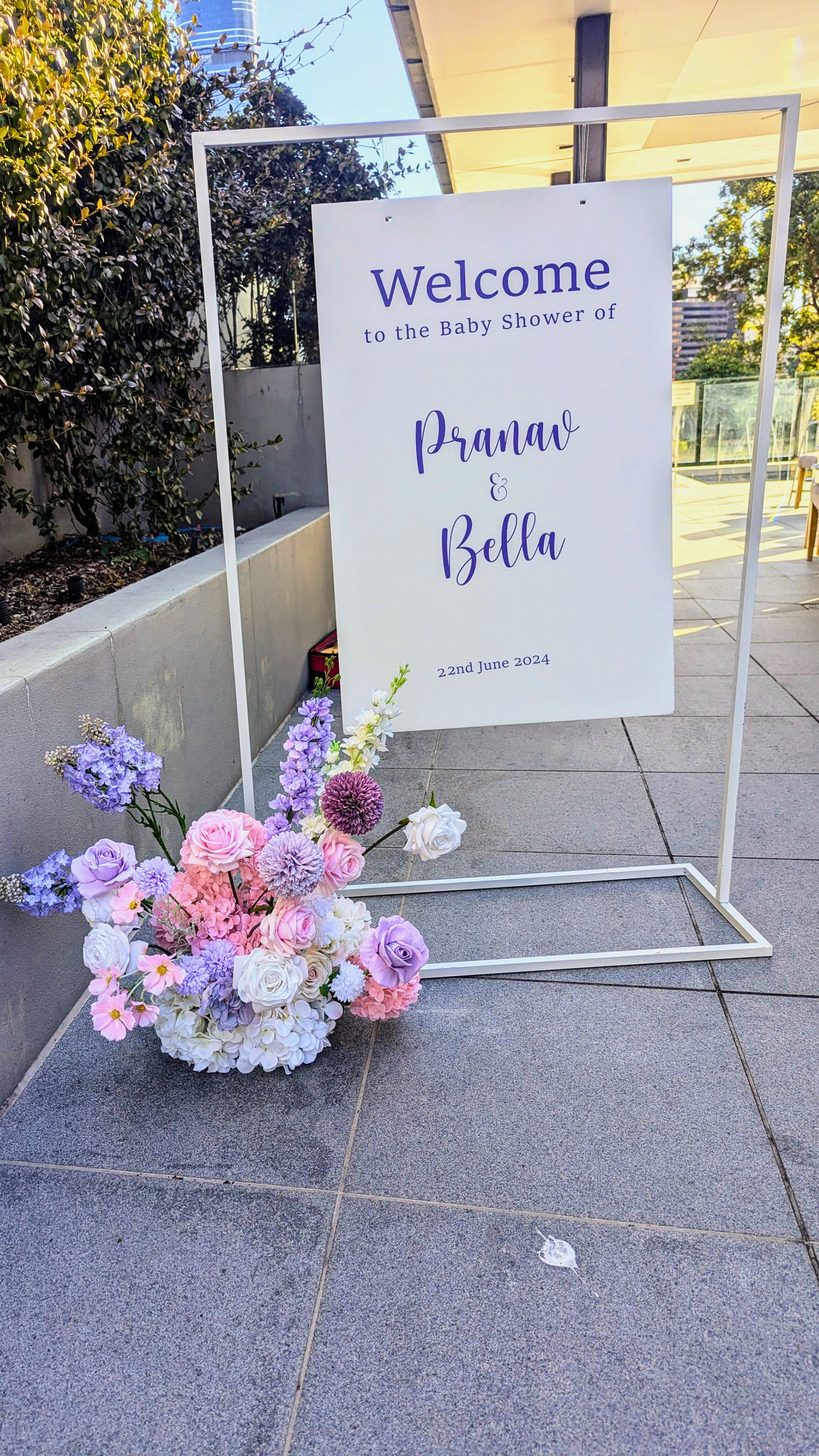Welcome sign for Pranav and Bella's baby shower, dated 23rd June 2024, with a colorful floral arrangement at the base. Prop hire, Prop hiring, Prop hire, event stylists Brisbane, brisbane event styling, brisbane event styling, event stylist Brisbane, Brisbane Wedding, Gold Coast Wedding, Floral Styling, Lush & Lavish Events, Brisbane Tablescape, Gold Coast Tablescapes, Brisbane Candle Hire