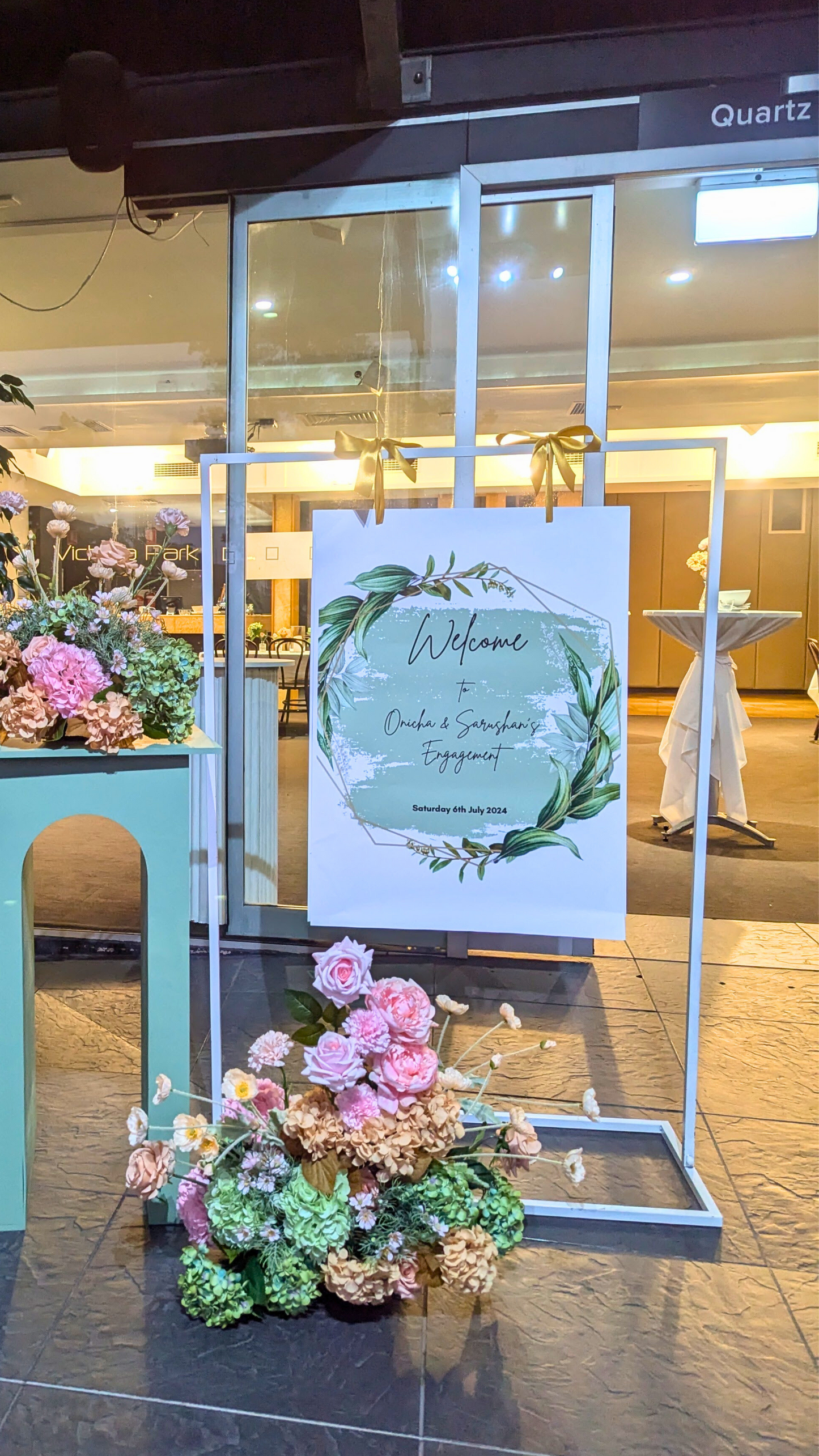 Wedding welcome sign with names and date, decorated with a floral wreath and arrangement, at the venue entrance. Prop hire, Prop hiring, Prop hire, event stylists Brisbane, brisbane event styling, brisbane event styling, event stylist Brisbane, Brisbane Wedding, Gold Coast Wedding, Floral Styling, Lush & Lavish Events, Brisbane Tablescape, Gold Coast Tablescapes, Brisbane Candle Hire