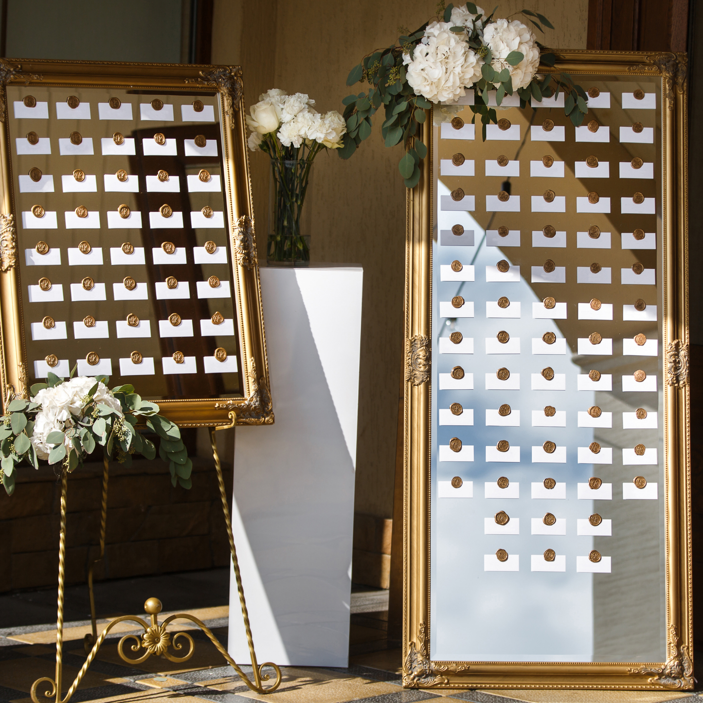 Two gold-framed seating charts with white place cards and floral arrangements. Prop hire, Prop hiring, Prop hire, event stylists Brisbane, brisbane event styling, brisbane event styling, event stylist Brisbane, Brisbane Wedding, Gold Coast Wedding, Floral Styling, Lush & Lavish Events, Brisbane Tablescape, Gold Coast Tablescapes, Brisbane Candle Hire