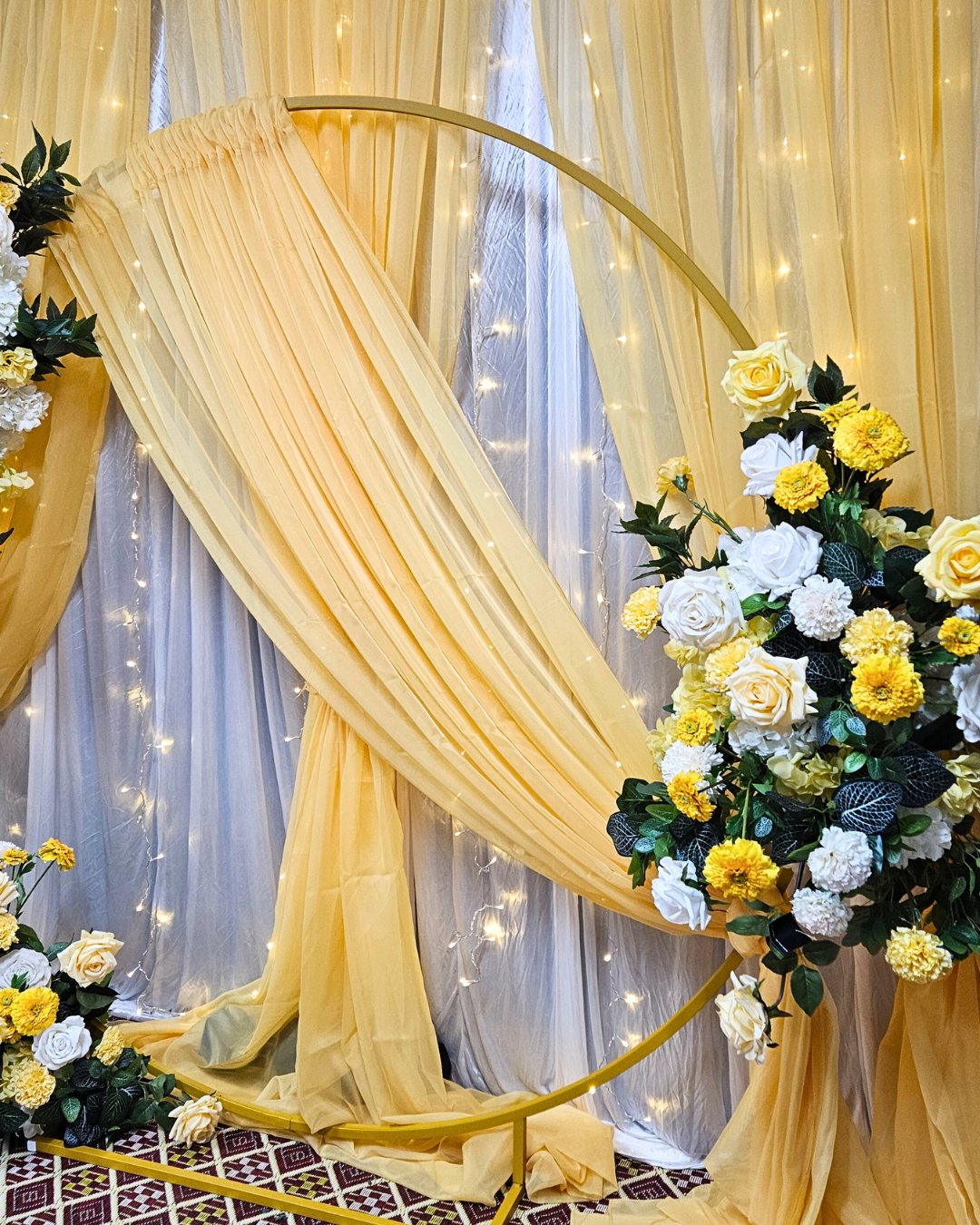 Yellow draped curtain backdrop with floral arrangements. Prop hire, Prop hiring, Prop hire, event stylists Brisbane, brisbane event styling, brisbane event styling, event stylist Brisbane, Brisbane Wedding, Gold Coast Wedding, Floral Styling, Lush & Lavish Events, Brisbane Corporate Styling, Gold Coast Corporate Styling, Brisbane Brand Activation, Gold Coast Tablescapes, Brisbane Candle Hire