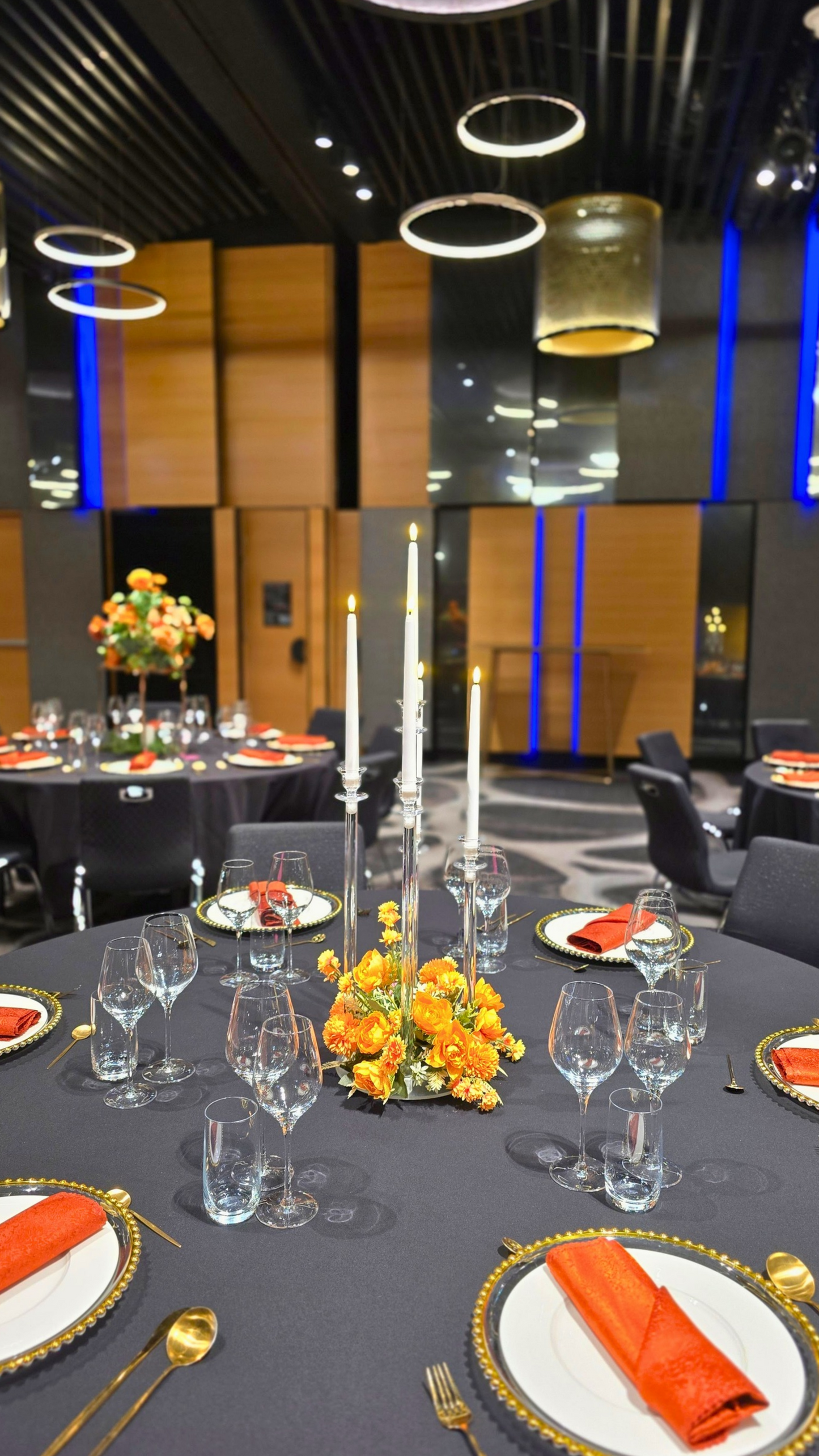 Dining table set for a formal event with place settings, glasses, and centerpieces in a modern indoor setting. candelabra hire Brisbane, acrylic candelabra Australia, wedding candelabra centrepiece, 5 arm candelabra hire QLD, floral candelabra centrepiece, tall wedding centrepieces Brisbane, clear candelabra hire Gold Coast, wedding table centrepieces Australia, luxe centrepiece hire Brisbane, candle centrepiece wedding QLD, modern wedding centrepieces Australia, acrylic wedding decor Brisbane, elegant cand