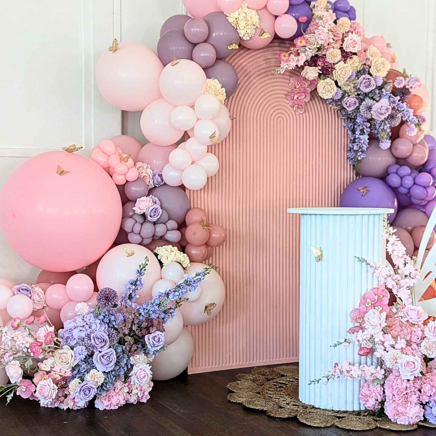 Floral and balloon backdrop in pinks and purples with gold butterfly's and a larger white butterfly. Prop hire, Prop hiring, Prop hire, event stylists Brisbane, brisbane event styling, brisbane event styling, event stylist Brisbane, Brisbane Wedding, Gold Coast Wedding, Floral Styling, Lush & Lavish Events, Brisbane Corporate Styling, Gold Coast Corporate Styling, Brisbane Brand Activation, Gold Coast Tablescapes, Brisbane Candle Hire