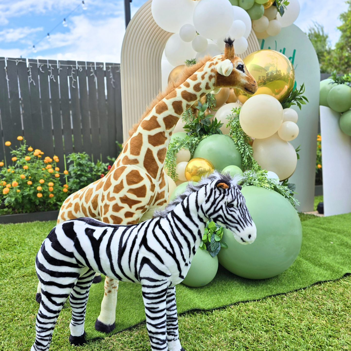 Balloon backdrop in white, green and gold, with green leaves immersed in the balloons. 5 safari animals and signage saying Wild Two. Prop hire, Prop hiring, Prop hire, event stylists Brisbane, brisbane event styling, brisbane event styling, event stylist Brisbane, Brisbane Wedding, Gold Coast Wedding, Floral Styling, Lush & Lavish Events, Brisbane Corporate Styling, Gold Coast Corporate Styling, Brisbane Brand Activation