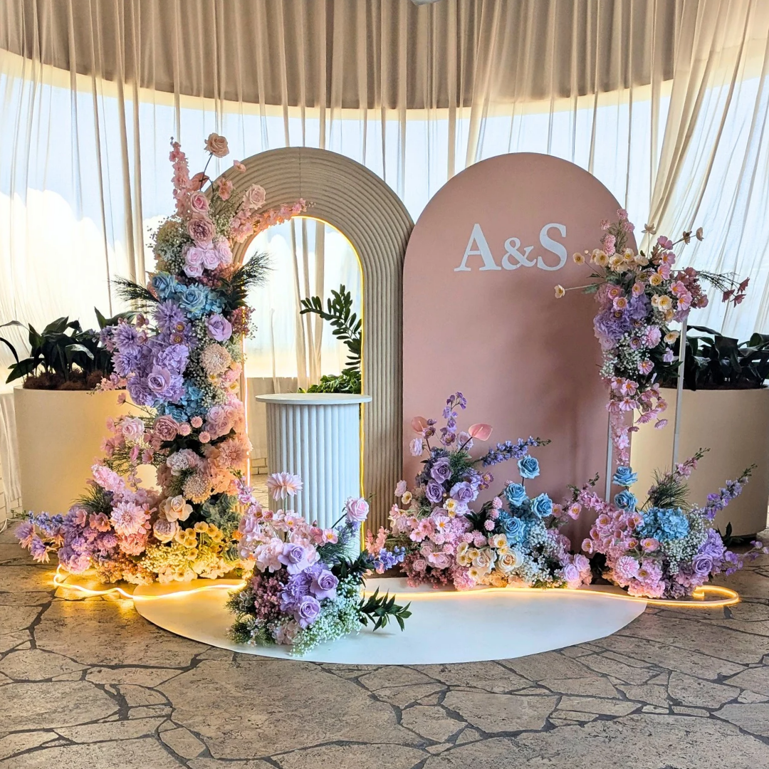 Decorative floral arch with 'A&S' initials at a formal event. pastel floral backdrop, engagement party backdrop, romantic event styling, Brisbane event hire, dreamy floral arch, elegant engagement decor, proposal backdrop hire, soft pastel wedding decor, custom event setup, bridal shower backdrop hire