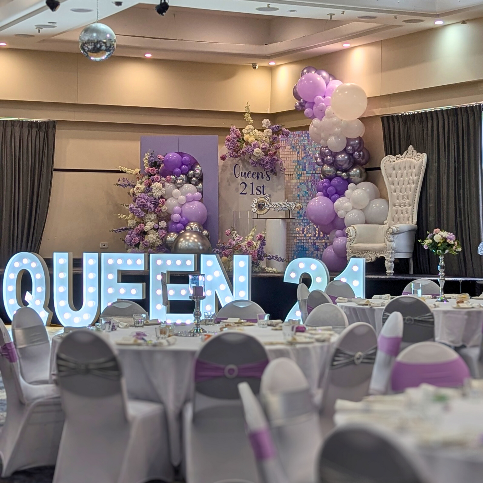 Purple and silver themed backdrop with shimmer wall. Large balloon installation with 3 floral arrangements. Prop hire, Prop hiring, Prop hire, event stylists Brisbane, brisbane event styling, brisbane event styling, event stylist Brisbane, Brisbane Wedding, Gold Coast Wedding, Floral Styling, Lush & Lavish Events, Brisbane Corporate Styling, Gold Coast Corporate Styling, Brisbane Brand Activation