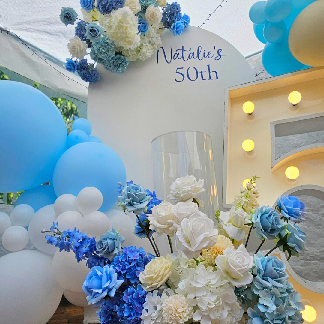 Blue and white balloon and floral backdrop for a 50th birthday. Large 50 LED numbers and a cake plinth. Prop hire, Prop hiring, Prop hire, event stylists Brisbane, brisbane event styling, brisbane event styling, event stylist Brisbane, Brisbane Wedding, Gold Coast Wedding, Floral Styling, Lush & Lavish Events, Brisbane Corporate Styling, Gold Coast Corporate Styling, Brisbane Brand Activation, Gold Coast Tablescapes, Brisbane Candle Hire