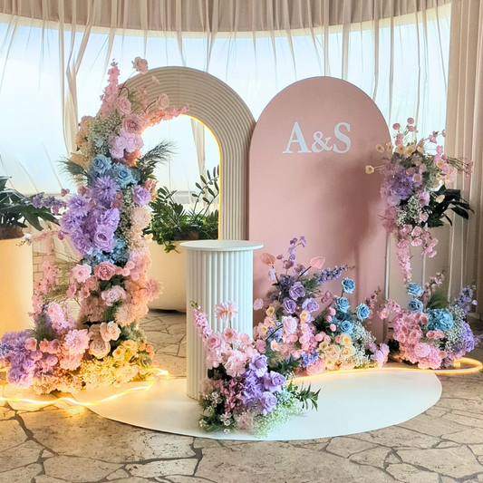 Decorative arch with floral arrangements and initials 'A&S' in a elegant setting. pastel floral backdrop, engagement party backdrop, romantic event styling, Brisbane event hire, dreamy floral arch, elegant engagement decor, proposal backdrop hire, soft pastel wedding decor, custom event setup, bridal shower backdrop hire