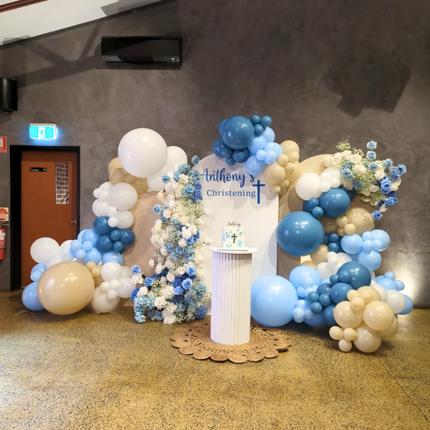 Blue, white and beige backdrop with floral pillar and medium floral arrangement. Prop hire, Prop hiring, Prop hire, event stylists Brisbane, brisbane event styling, brisbane event styling, event stylist Brisbane, Brisbane Wedding, Gold Coast Wedding, Floral Styling, Lush & Lavish Events, Brisbane Corporate Styling, Gold Coast Corporate Styling, Brisbane Brand Activation