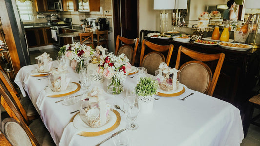 A long rectangular table with a white tablecloth set for a special occasion. Prop hire, Prop hiring, Prop hire, event stylists Brisbane, brisbane event styling, brisbane event styling, event stylist Brisbane, Brisbane Wedding, Gold Coast Wedding, Floral Styling, Lush & Lavish Events, Brisbane Tablescape, Gold Coast Tablescapes, Brisbane Candle Hire