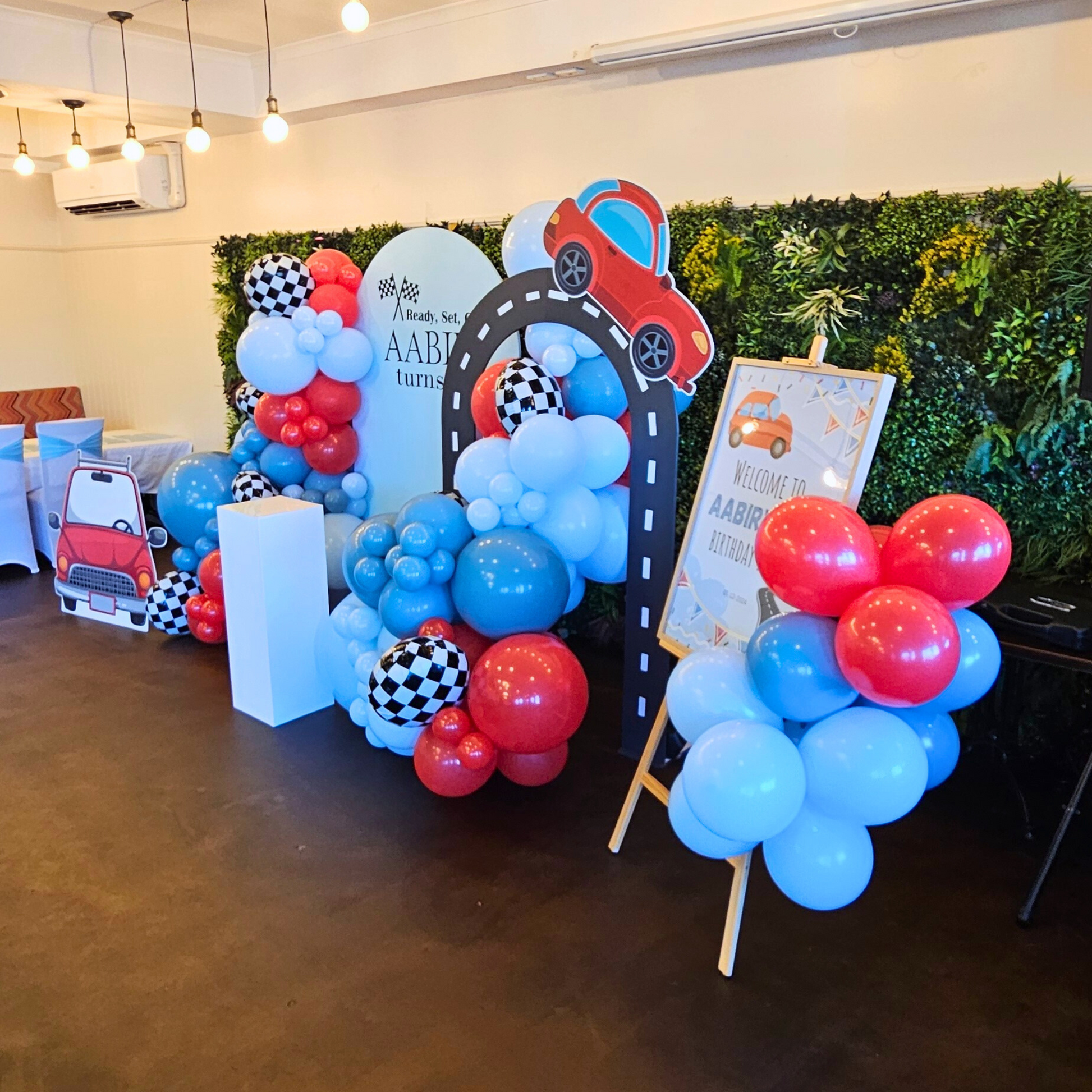 Luxe balloon backdrop with checkered print foil balloons and 2 car cutouts. Prop hire, Prop hiring, Prop hire, event stylists Brisbane, brisbane event styling, brisbane event styling, event stylist Brisbane, Brisbane Wedding, Gold Coast Wedding, Floral Styling, Lush & Lavish Events, Brisbane Corporate Styling, Gold Coast Corporate Styling, Brisbane Brand Activation