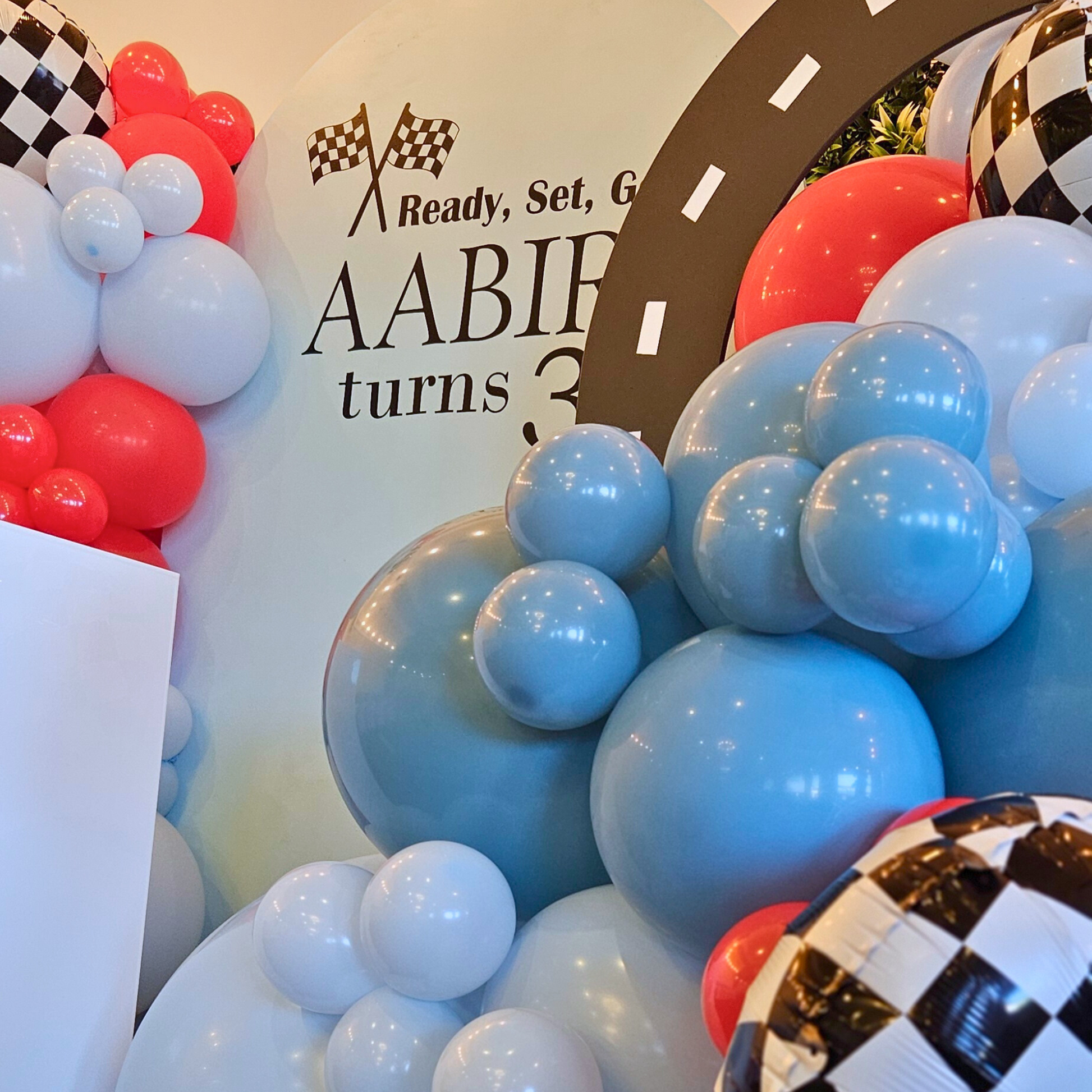 Luxe balloon backdrop with checkered print foil balloons and 2 car cutouts. Prop hire, Prop hiring, Prop hire, event stylists Brisbane, brisbane event styling, brisbane event styling, event stylist Brisbane, Brisbane Wedding, Gold Coast Wedding, Floral Styling, Lush & Lavish Events, Brisbane Corporate Styling, Gold Coast Corporate Styling, Brisbane Brand Activation