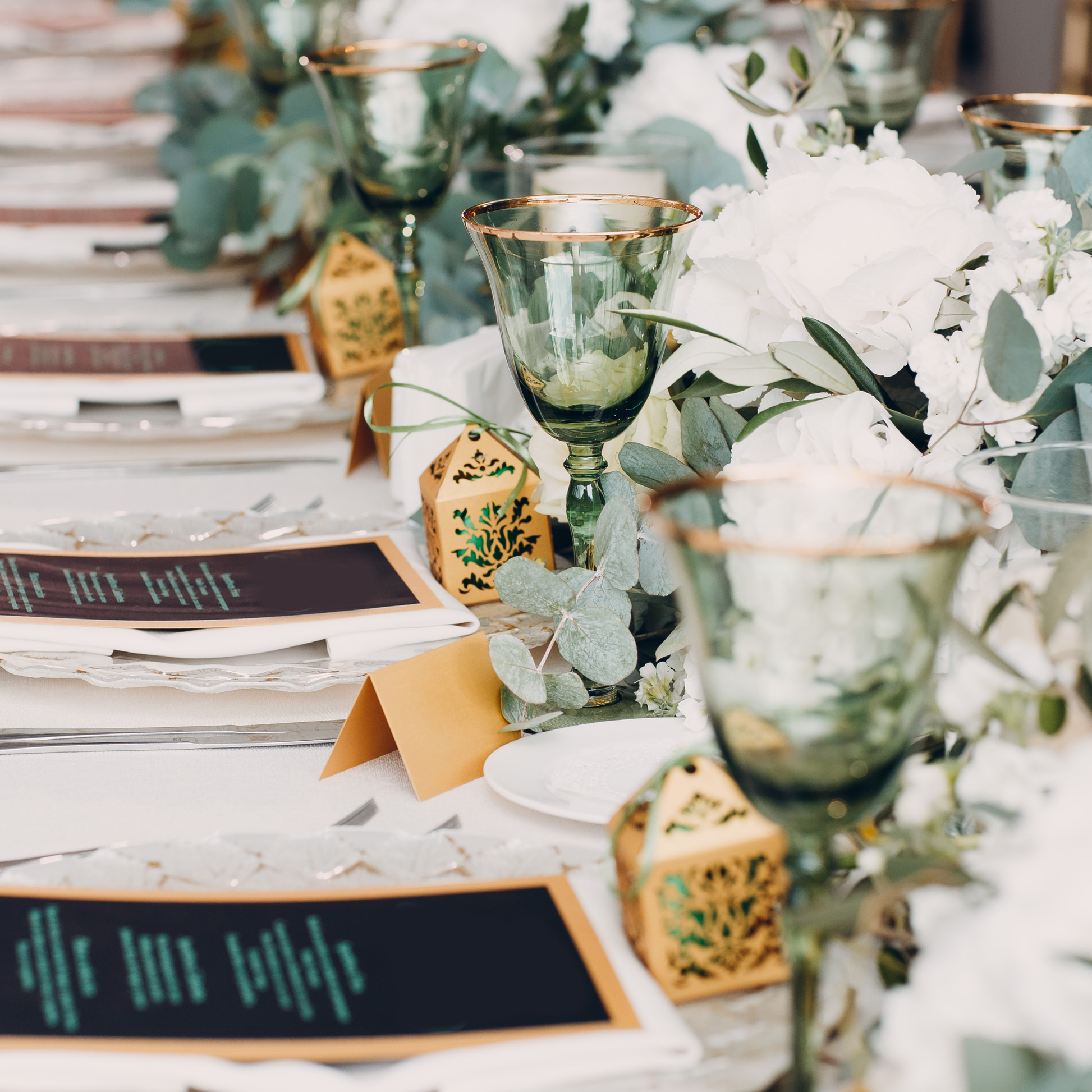 Elegant dining table set with green goblets, white floral arrangements, and gold accents, ready for a formal event. Prop hire, Prop hiring, Prop hire, event stylists Brisbane, brisbane event styling, brisbane event styling, event stylist Brisbane, Brisbane Wedding, Gold Coast Wedding, Floral Styling, Lush & Lavish Events, Brisbane Tablescape, Gold Coast Tablescapes, Brisbane Candle Hire