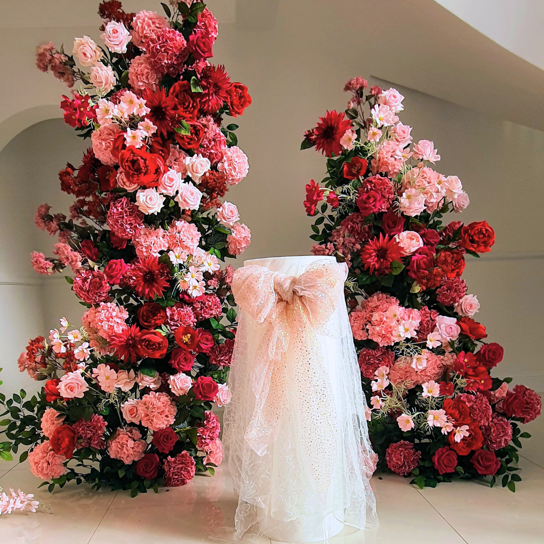 Red Pink floral pillars, custom welcome sign, tulle cake cutting plinth with floral arrangement and table decor. Prop hire, Prop hiring, Prop hire, event stylists Brisbane, brisbane event styling, brisbane event styling, event stylist Brisbane, Brisbane Wedding, Gold Coast Wedding, Floral Styling, Lush & Lavish Events, Brisbane Corporate Styling, Gold Coast Corporate Styling, Brisbane Brand Activation, Gold Coast Tablescapes, Brisbane Candle Hire