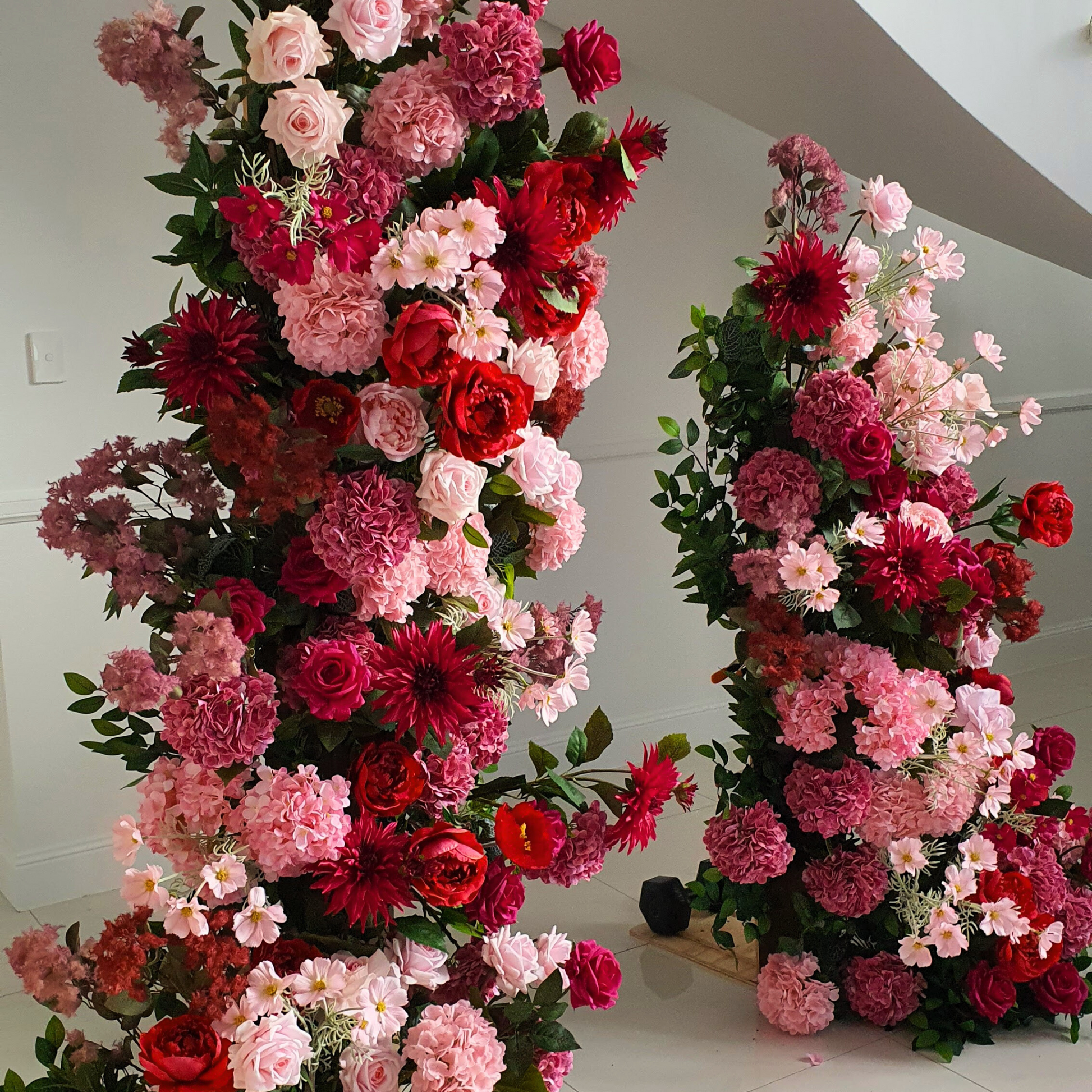 Red Pink floral pillars, custom welcome sign, tulle cake cutting plinth with floral arrangement and table decor. Prop hire, Prop hiring, Prop hire, event stylists Brisbane, brisbane event styling, brisbane event styling, event stylist Brisbane, Brisbane Wedding, Gold Coast Wedding, Floral Styling, Lush & Lavish Events, Brisbane Corporate Styling, Gold Coast Corporate Styling, Brisbane Brand Activation, Gold Coast Tablescapes, Brisbane Candle Hire
