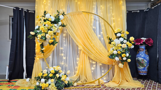 Yellow draped curtain backdrop with floral arrangements. Prop hire, Prop hiring, Prop hire, event stylists Brisbane, brisbane event styling, brisbane event styling, event stylist Brisbane, Brisbane Wedding, Gold Coast Wedding, Floral Styling, Lush & Lavish Events, Brisbane Corporate Styling, Gold Coast Corporate Styling, Brisbane Brand Activation, Gold Coast Tablescapes, Brisbane Candle Hire
