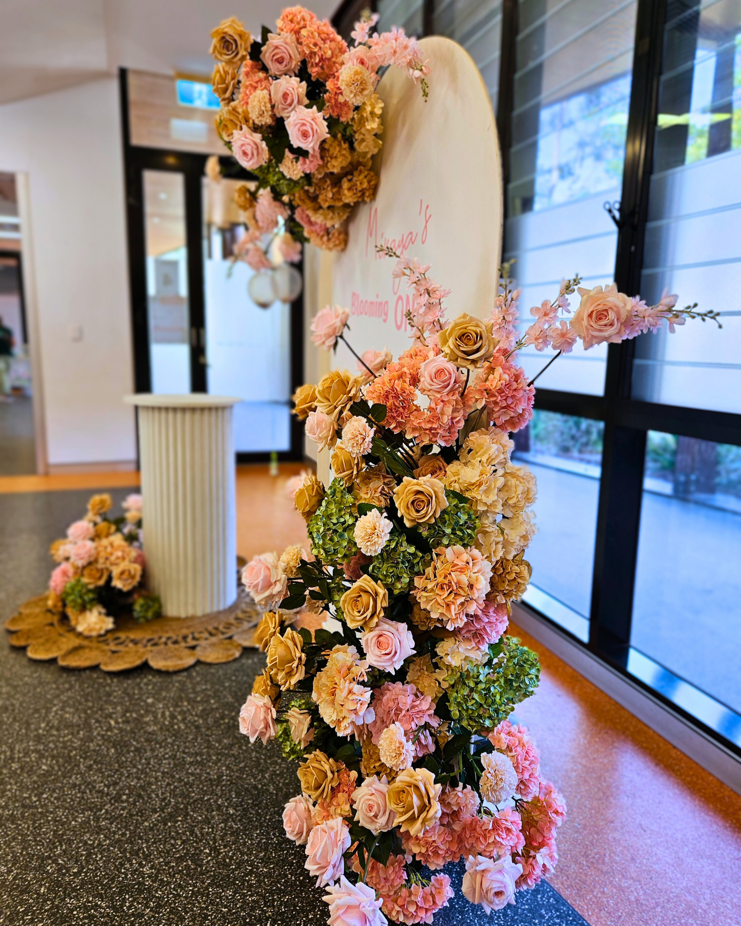 Floral backdrop in green, pink and neutral, signage "Miraja's Blooming ONE" Prop hire, Prop hiring, Prop hire, event stylists Brisbane, brisbane event styling, brisbane event styling, event stylist Brisbane, Brisbane Wedding, Gold Coast Wedding, Floral Styling, Lush & Lavish Events, Brisbane Corporate Styling, Gold Coast Corporate Styling, Brisbane Brand Activation, Gold Coast Tablescapes, Brisbane Candle Hire