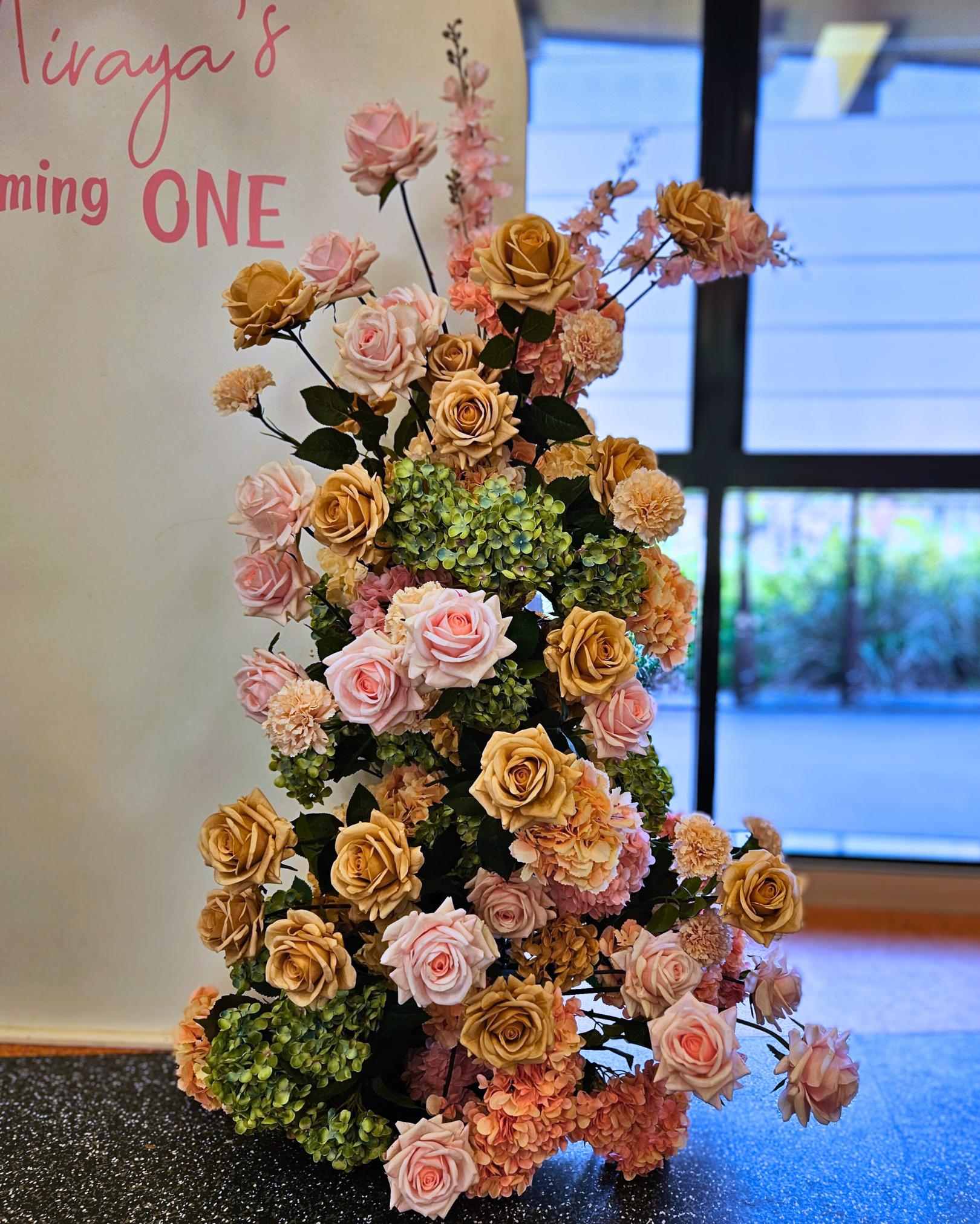 Floral backdrop in green, pink and neutral, signage "Miraja's Blooming ONE" Prop hire, Prop hiring, Prop hire, event stylists Brisbane, brisbane event styling, brisbane event styling, event stylist Brisbane, Brisbane Wedding, Gold Coast Wedding, Floral Styling, Lush & Lavish Events, Brisbane Corporate Styling, Gold Coast Corporate Styling, Brisbane Brand Activation, Gold Coast Tablescapes, Brisbane Candle Hire