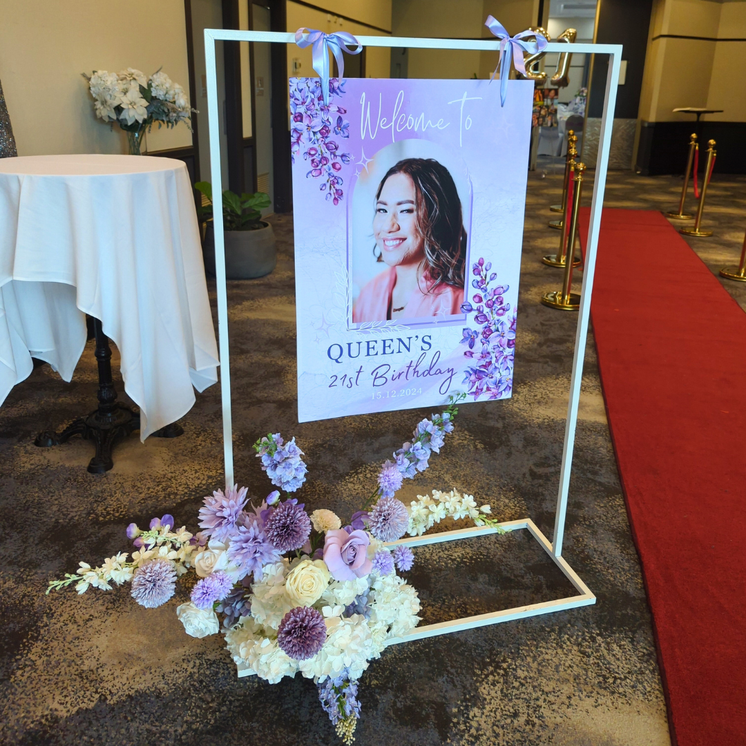 Purple, white silver floral and balloon backdrop with an iridescent shimmer wall. Signage says "Queen's 21st" with large LED lights. Prop hire, Prop hiring, Prop hire, event stylists Brisbane, brisbane event styling, brisbane event styling, event stylist Brisbane, Brisbane Wedding, Gold Coast Wedding, Floral Styling, Lush & Lavish Events, Brisbane Corporate Styling, Gold Coast Corporate Styling, Brisbane Brand Activation, Gold Coast Tablescapes, Brisbane Candle Hire