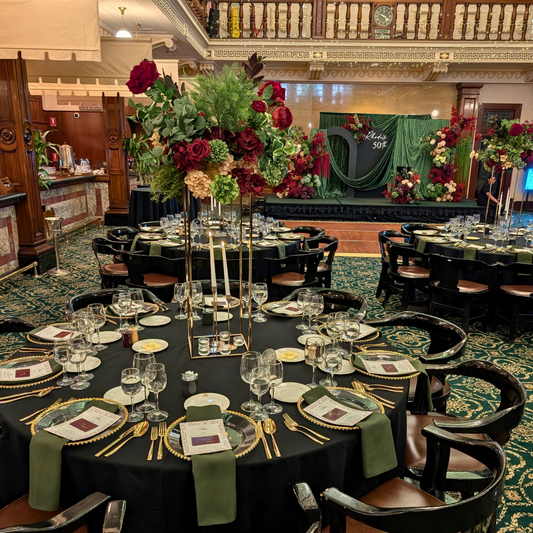 Decorated banquet hall with tables set for a formal event, featuring floral centerpieces and elegant table settings. brisbane event styling, brisbane event planner, brisbane on the day coordination, brisbane 50th birthday styling, luxury event styling brisbane, brisbane birthday event planner, event stylist brisbane australia, brisbane venue styling ideas, elegant birthday styling brisbane, brisbane event design services, corporate event styling brisbane, brisbane party stylist, moody event styling brisbane