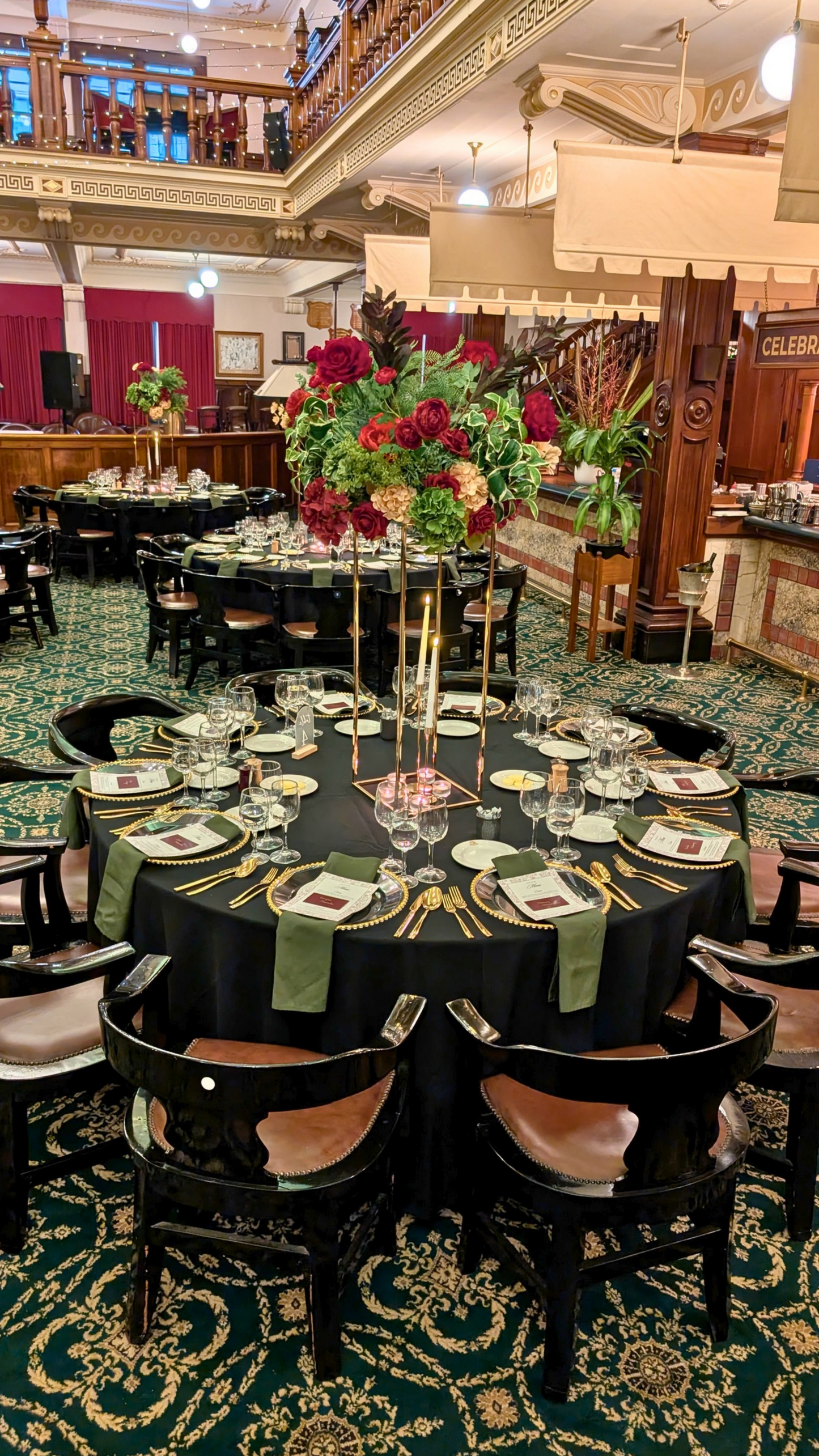 Decorated dining tables with floral centerpieces in a grand hall. tall floral centrepieces Brisbane, wedding centrepieces hire Brisbane, gold stand centrepieces Australia, tall wedding centrepieces QLD, floral plinth centrepiece hire, luxe wedding centrepieces Australia, event centrepiece hire Gold Coast, tall table centrepieces Brisbane, custom floral centrepieces QLD, wedding table styling Brisbane, elegant centrepieces Sunshine Coast, large floral centrepieces Australia, reception centrepieces Brisbane, 