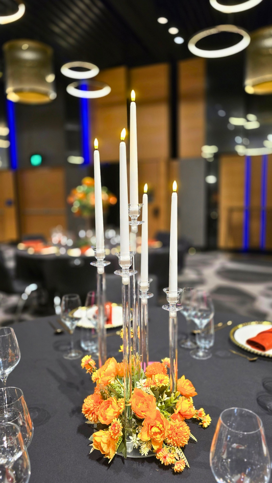 Decorative table setting with candles and flowers in a formal dining room. candelabra hire Brisbane, acrylic candelabra Australia, wedding candelabra centrepiece, 5 arm candelabra hire QLD, floral candelabra centrepiece, tall wedding centrepieces Brisbane, clear candelabra hire Gold Coast, wedding table centrepieces Australia, luxe centrepiece hire Brisbane, candle centrepiece wedding QLD, modern wedding centrepieces Australia, acrylic wedding decor Brisbane, elegant candelabra hire Sunshine Coast, receptio
