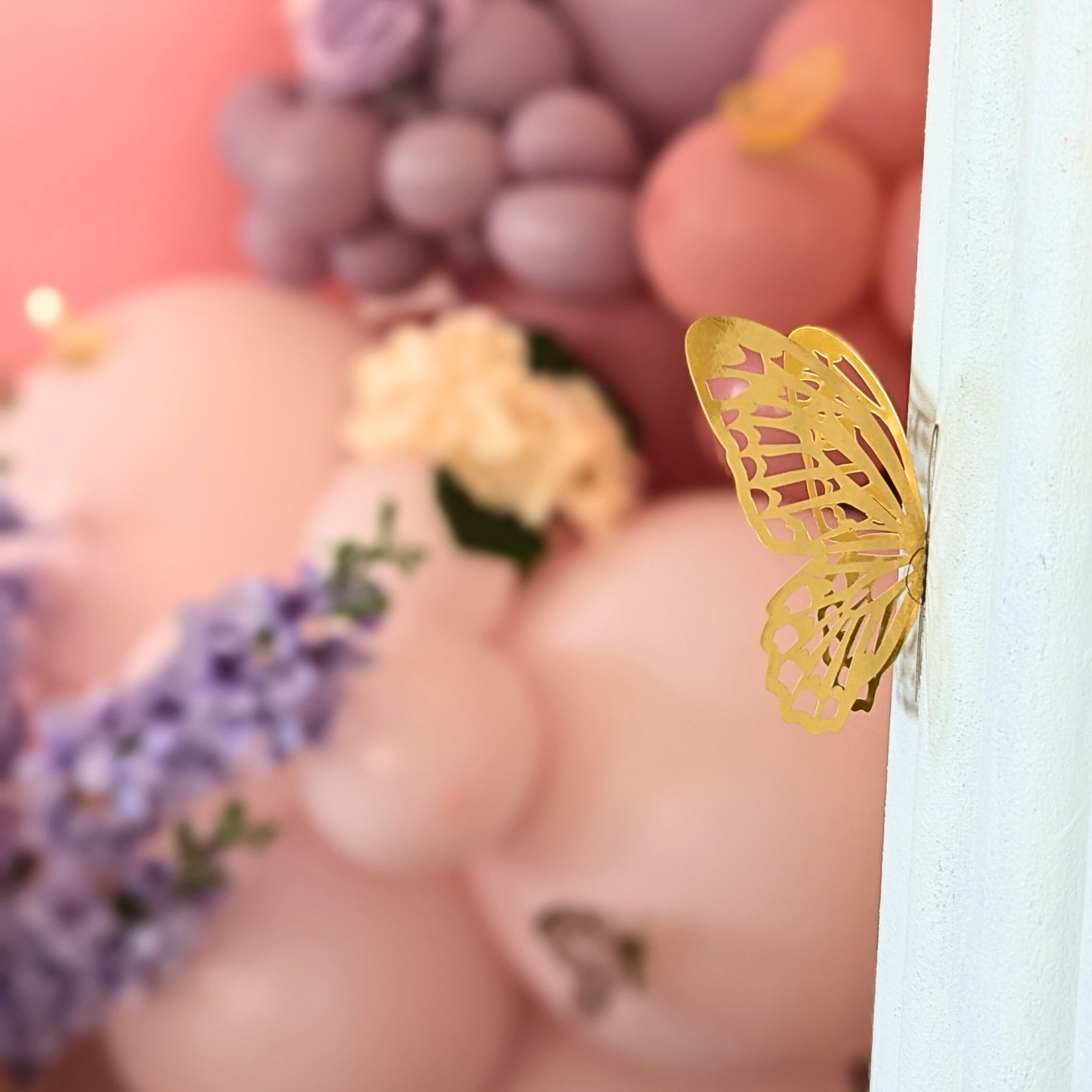 Floral and balloon backdrop in pinks and purples with gold butterfly's and a larger white butterfly. Prop hire, Prop hiring, Prop hire, event stylists Brisbane, brisbane event styling, brisbane event styling, event stylist Brisbane, Brisbane Wedding, Gold Coast Wedding, Floral Styling, Lush & Lavish Events, Brisbane Corporate Styling, Gold Coast Corporate Styling, Brisbane Brand Activation, Gold Coast Tablescapes, Brisbane Candle Hire