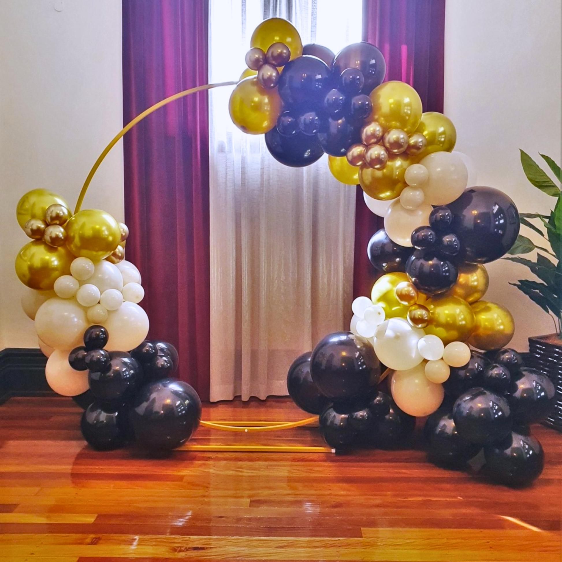 Balloon arch in black, gold, and white, with black clusters at both ends and a gradient mix of gold and white balloons in the middle. Prop hire, Prop hiring, Prop hire, event stylists Brisbane, brisbane event styling, brisbane event styling, event stylist Brisbane, Brisbane Wedding, Gold Coast Wedding, Floral Styling, Lush & Lavish Events, Brisbane Tablescape, Gold Coast Tablescapes, Brisbane Candle Hire