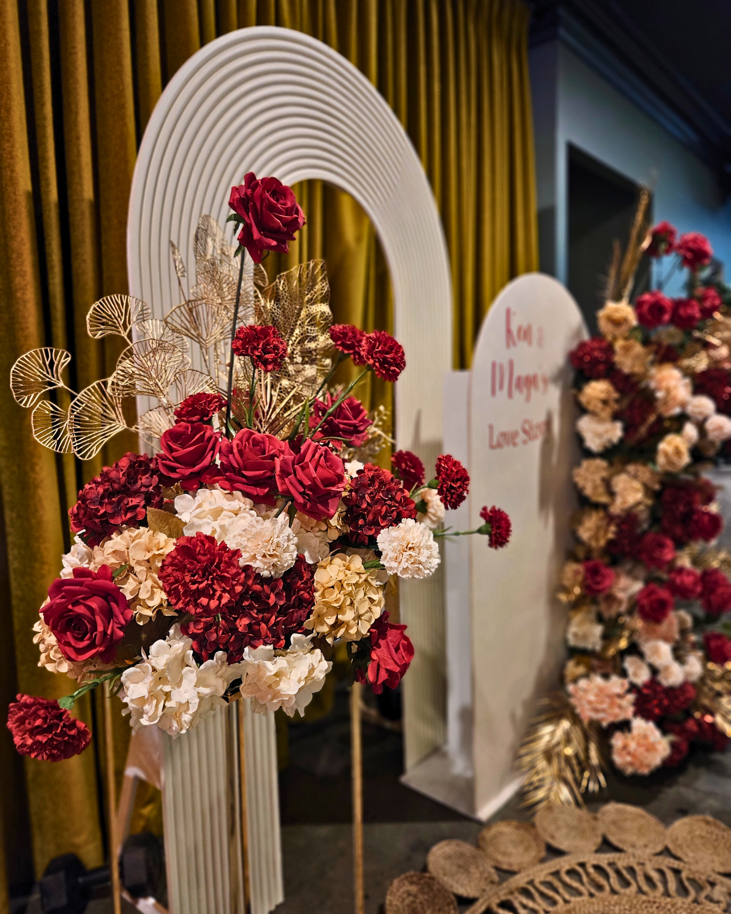 Floral backdrop in red, cream and gold. Signage says "Ken & Maya's Love Story". Balloon backdrop in white, green and gold, with green leaves immersed in the balloons. 5 safari animals and signage saying Wild Two. Prop hire, Prop hiring, Prop hire, event stylists Brisbane, brisbane event styling, brisbane event styling, event stylist Brisbane, Brisbane Wedding, Gold Coast Wedding, Floral Styling, Lush & Lavish Events, Brisbane Corporate Styling, Gold Coast Corporate Styling, Brisbane Brand Activation