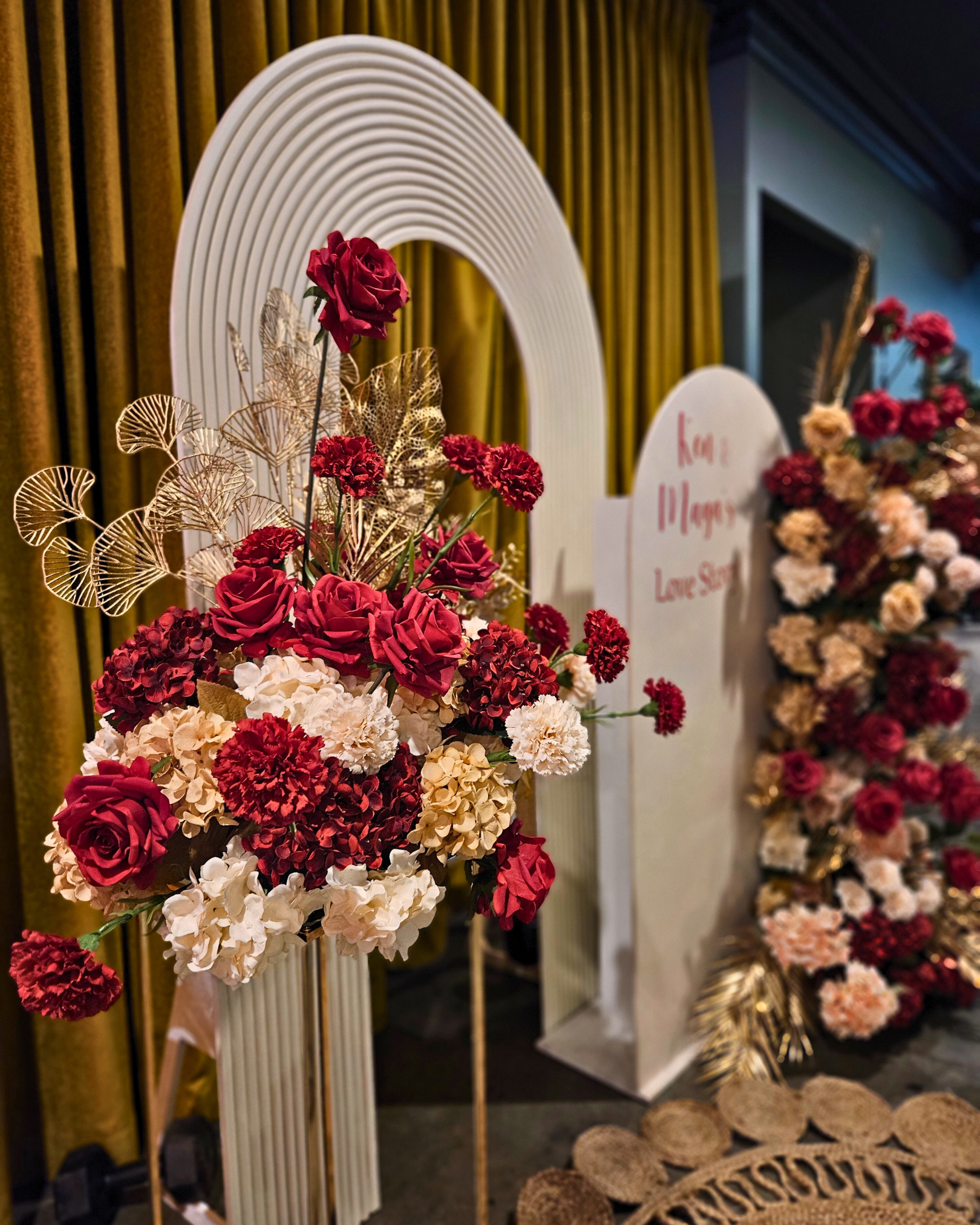 Floral backdrop in red, cream and gold. Signage says "Ken & Maya's Love Story". Balloon backdrop in white, green and gold, with green leaves immersed in the balloons. 5 safari animals and signage saying Wild Two. Prop hire, Prop hiring, Prop hire, event stylists Brisbane, brisbane event styling, brisbane event styling, event stylist Brisbane, Brisbane Wedding, Gold Coast Wedding, Floral Styling, Lush & Lavish Events, Brisbane Corporate Styling, Gold Coast Corporate Styling, Brisbane Brand Activation