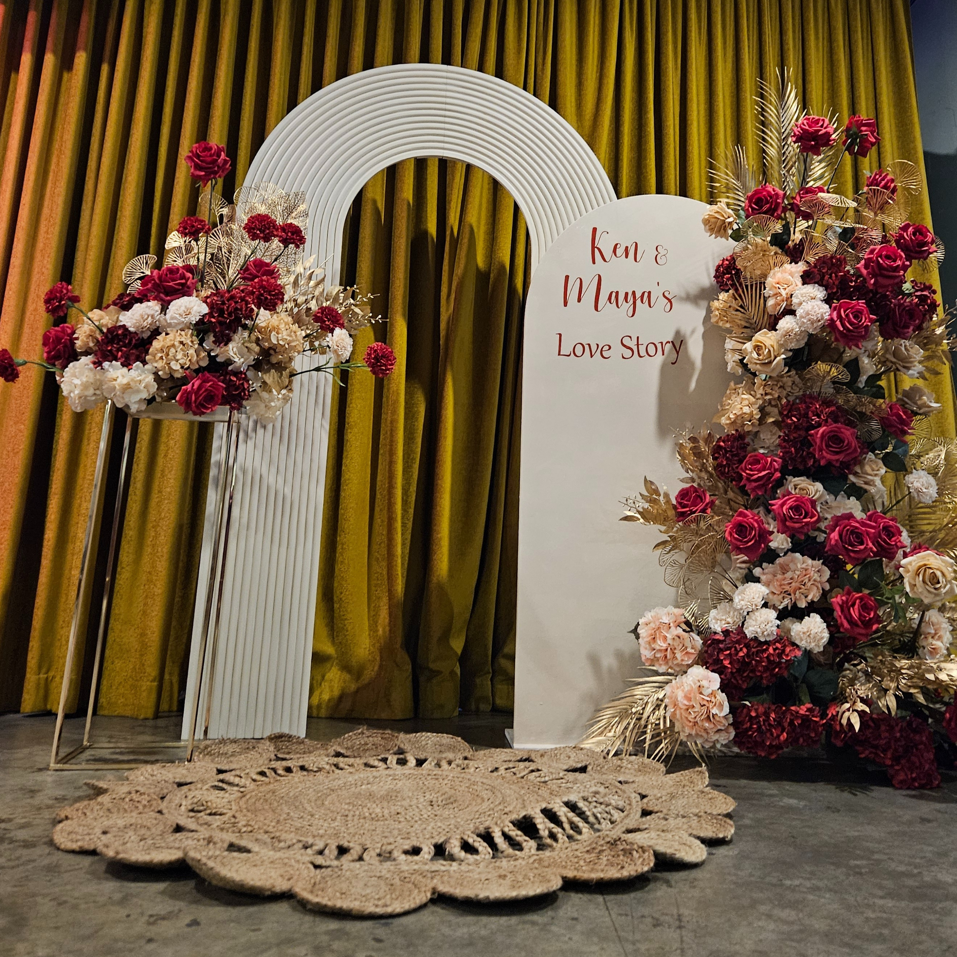 Floral backdrop in red, cream and gold. Signage says "Ken & Maya's Love Story". Balloon backdrop in white, green and gold, with green leaves immersed in the balloons. 5 safari animals and signage saying Wild Two. Prop hire, Prop hiring, Prop hire, event stylists Brisbane, brisbane event styling, brisbane event styling, event stylist Brisbane, Brisbane Wedding, Gold Coast Wedding, Floral Styling, Lush & Lavish Events, Brisbane Corporate Styling, Gold Coast Corporate Styling, Brisbane Brand Activation