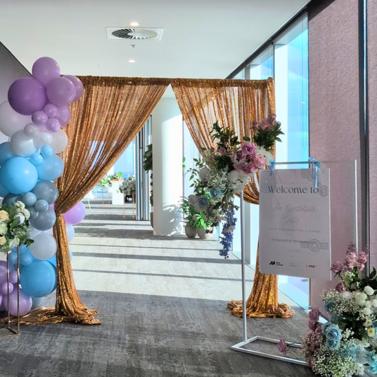 Decorative entrance with balloons, flowers, and a welcome sign. Brisbane corporate event styling, Gold Coast corporate event styling, Brisbane brand activation styling, Gold Coast brand activation styling, Brisbane event entrance styling, Gold Coast event entrance styling, Brisbane balloon garland corporate, Gold Coast balloon garland corporate, Brisbane corporate event decor, Gold Coast corporate event decor, Brisbane conference styling, Gold Coast conference styling, Brisbane product launch styling, Gold 