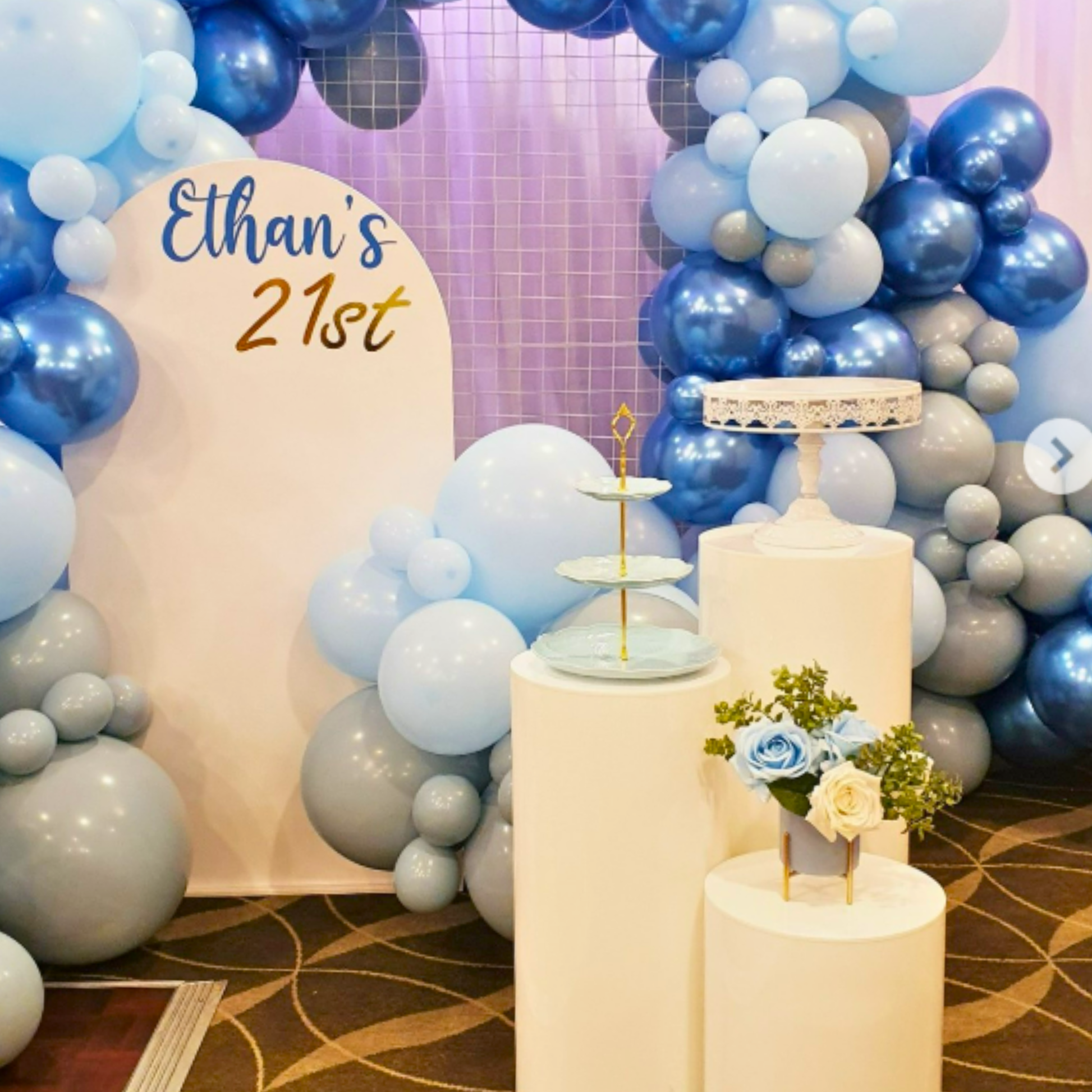 Balloon arch with 'Ethan's 21st' text, cake stand, and floral decorations. pink cupcake stand hire, blue cupcake stand hire, 3 tier cupcake stand hire, cupcake stand hire brisbane, cupcake stand hire gold coast, kids party cupcake stand, birthday party dessert stand, baby shower cupcake stand, party decor hire qld, dessert table styling hire, colourful cupcake stand, party prop hire brisbane, party hire gold coast, kids birthday party decor, cupcake display stand hire, themed party decor hire, event styling