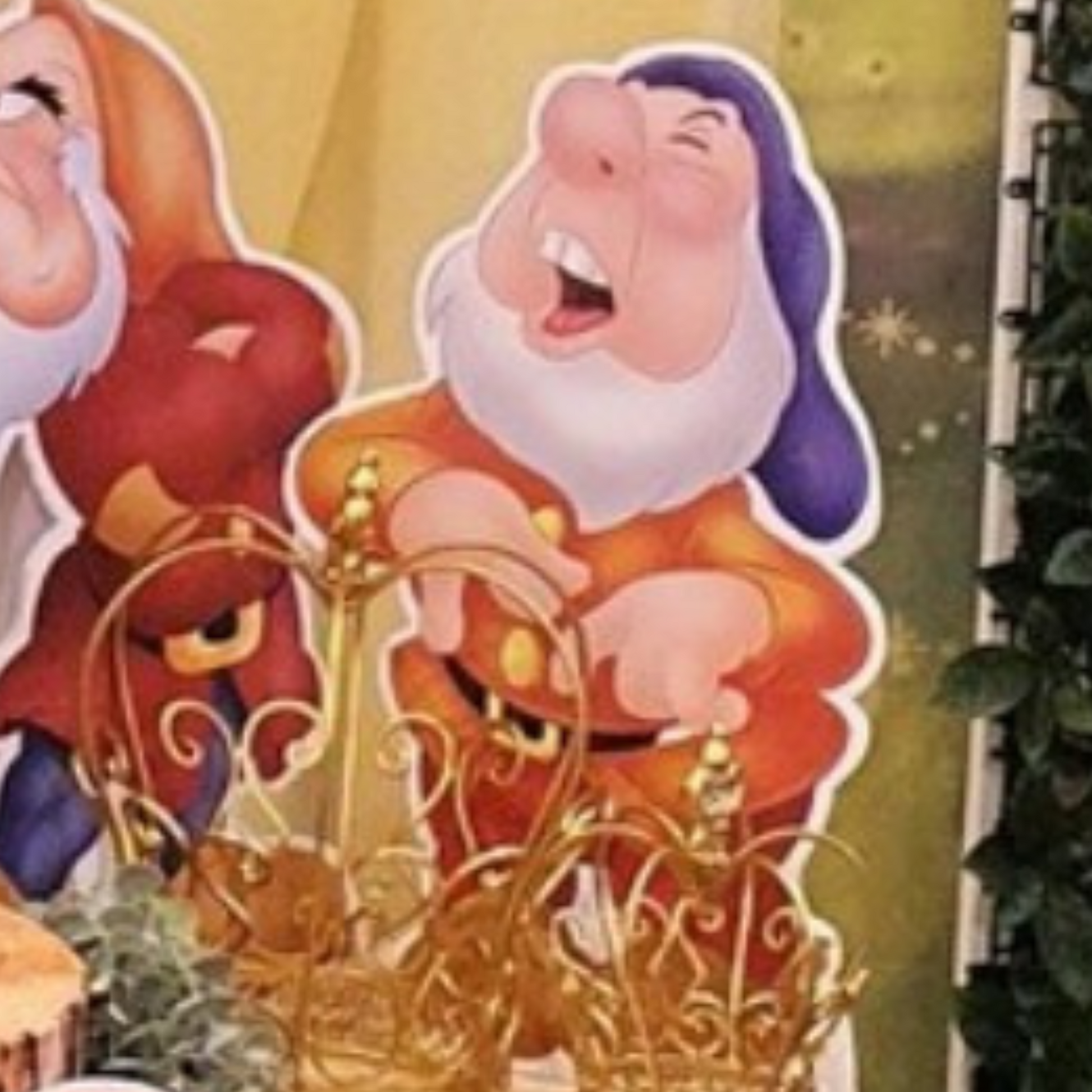 Cutout of a dwarf character from Snow White, positioned in front of colorful balloons with a blurred background, ideal for themed parties or events. Prop hire, Prop hiring, Prop hire, event stylists Brisbane, brisbane event styling, brisbane event styling, event stylist Brisbane, Brisbane Wedding, Gold Coast Wedding, Floral Styling, Lush & Lavish Events, Brisbane Tablescape, Gold Coast Tablescapes, Brisbane Candle Hire