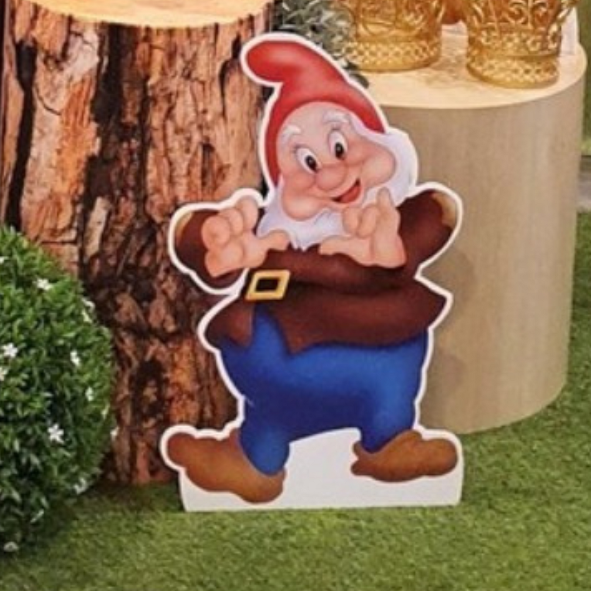 Cutout of a dwarf character from Snow White, positioned in front of colorful balloons with a blurred background, ideal for themed parties or events. Prop hire, Prop hiring, Prop hire, event stylists Brisbane, brisbane event styling, brisbane event styling, event stylist Brisbane, Brisbane Wedding, Gold Coast Wedding, Floral Styling, Lush & Lavish Events, Brisbane Tablescape, Gold Coast Tablescapes, Brisbane Candle Hire